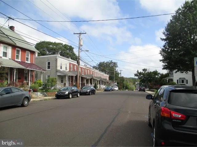 a sign that is sitting in front of flowers
