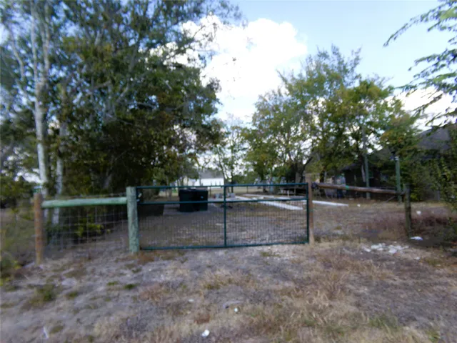 a view of a backyard with trees