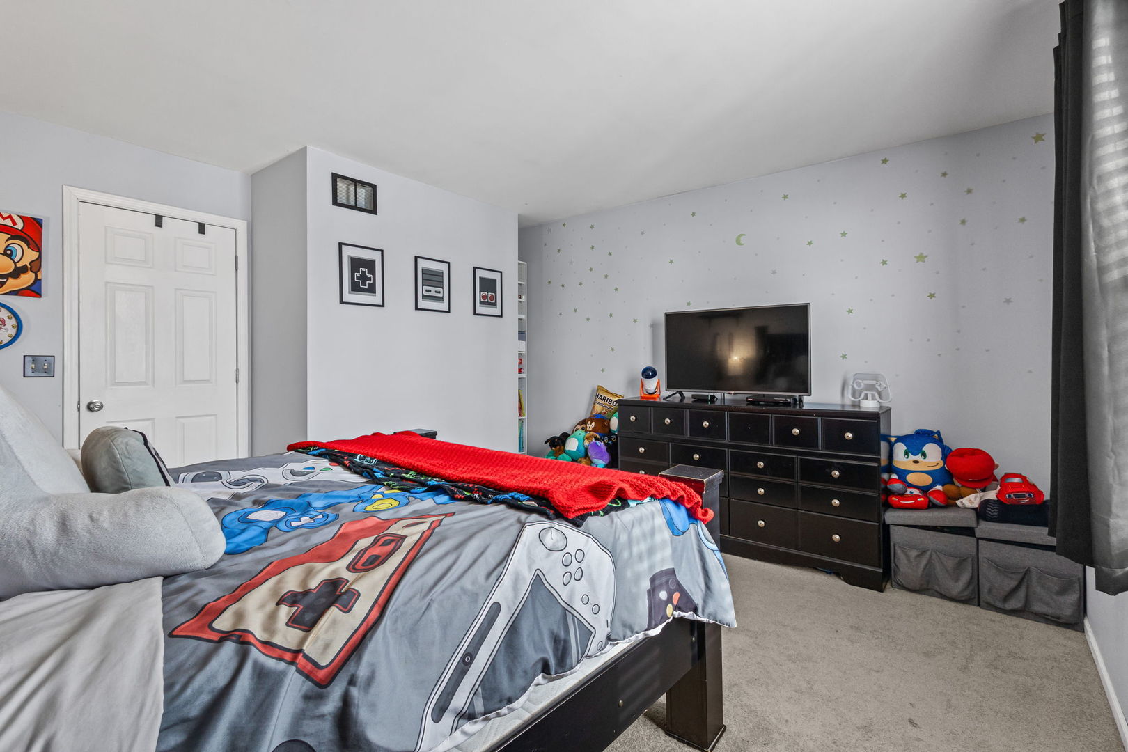 16703 South Sunset Ridge Court Lockport, IL 60441 - Photo 11 of 15 a bedroom with a bed and a flat screen tv
