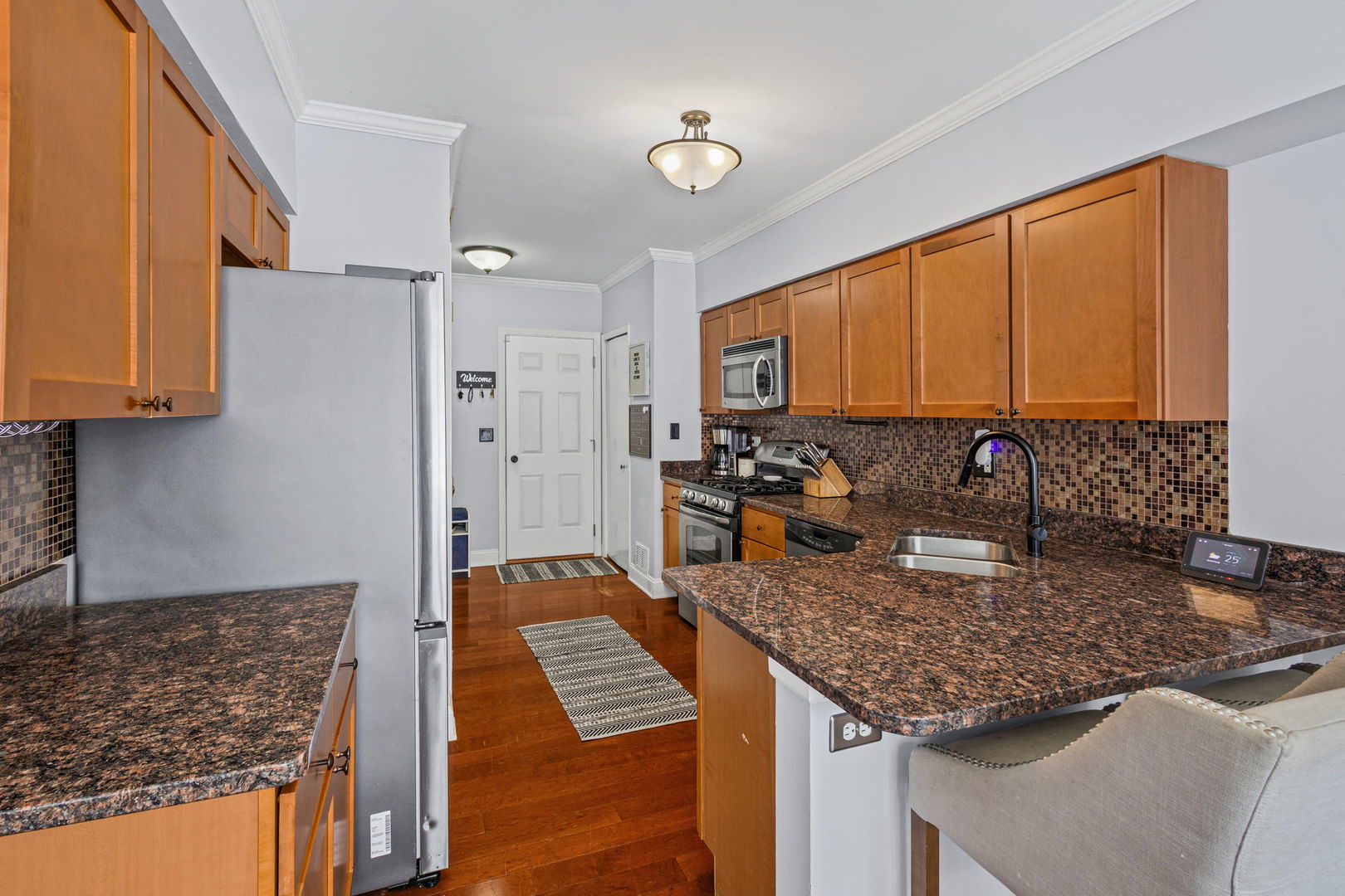 16703 South Sunset Ridge Court Lockport, IL 60441 - Photo 6 of 15 a kitchen with sink refrigerator and cabinets