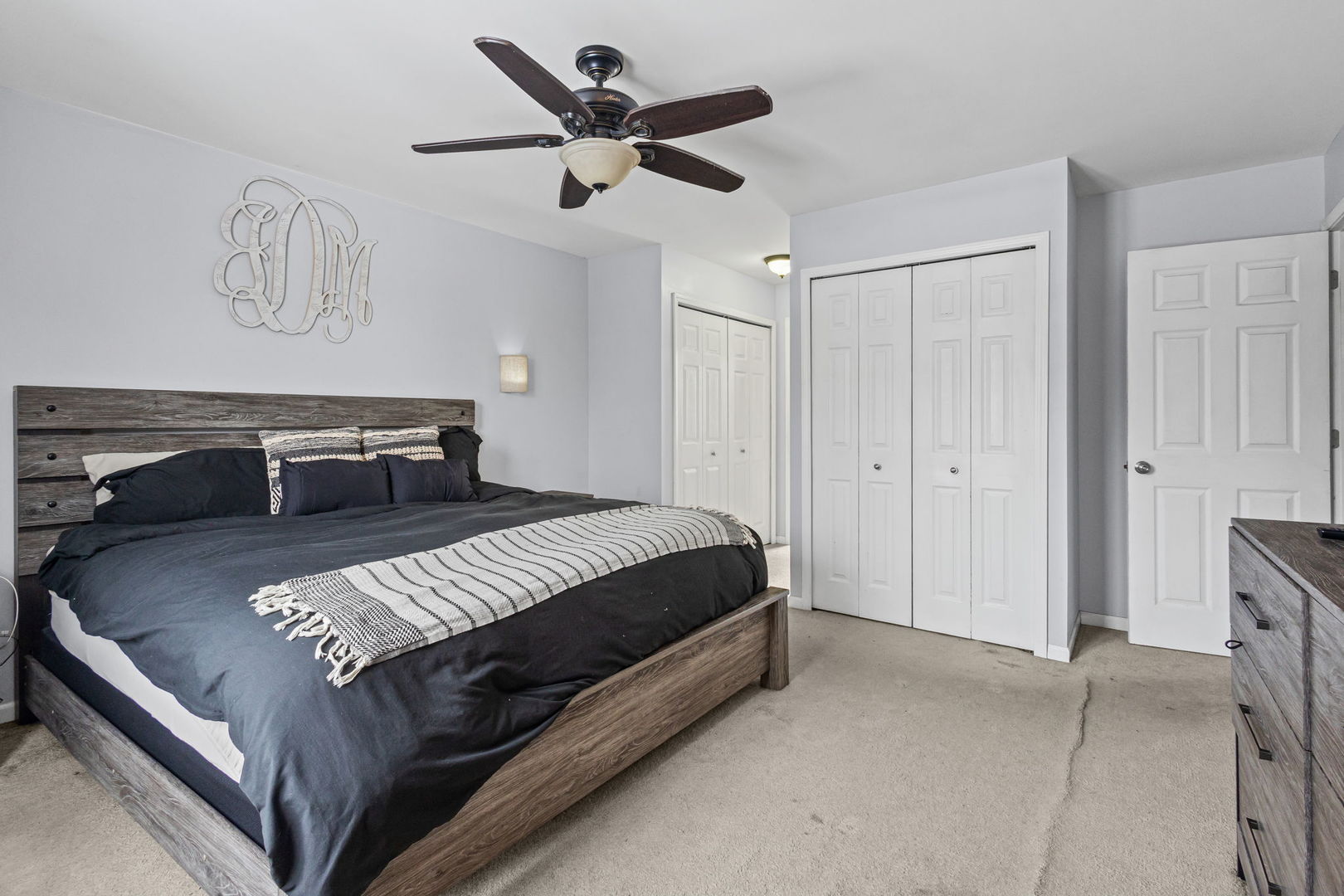 16703 South Sunset Ridge Court Lockport, IL 60441 - Photo 9 of 15 a bedroom with a bed and a chandelier