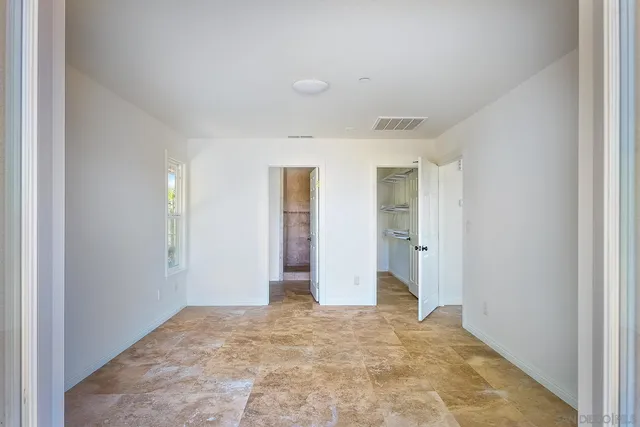 a view of an empty room and window