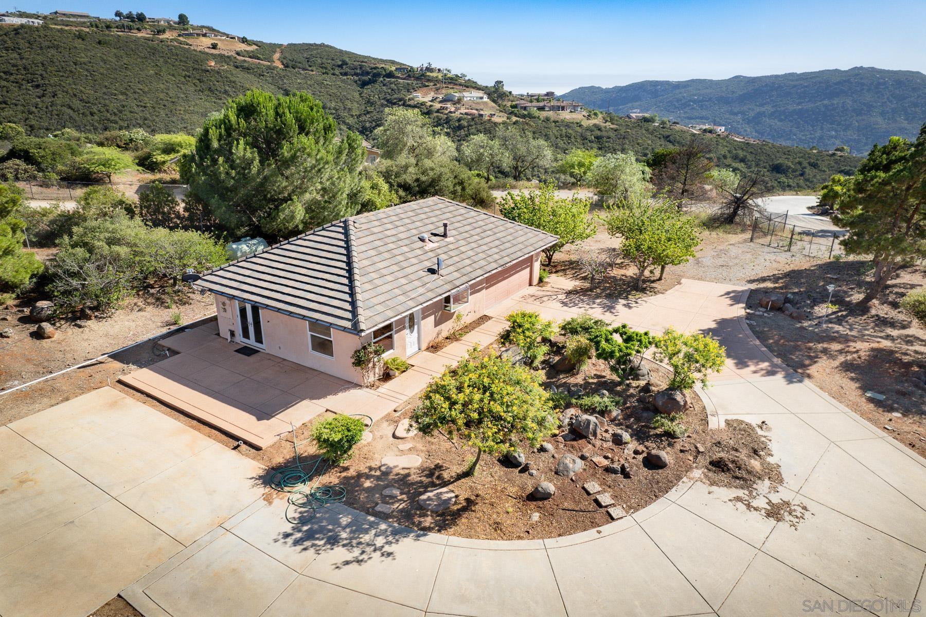 38960 Magee Road Pala, CA 92059 - Photo 17 of 25 a view of a backyard with sitting area