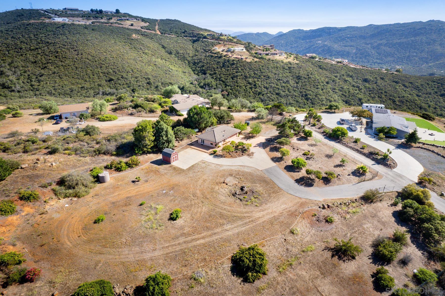 38960 Magee Road Pala, CA 92059 - Photo 21 of 25 an aerial view of a house with a mountain