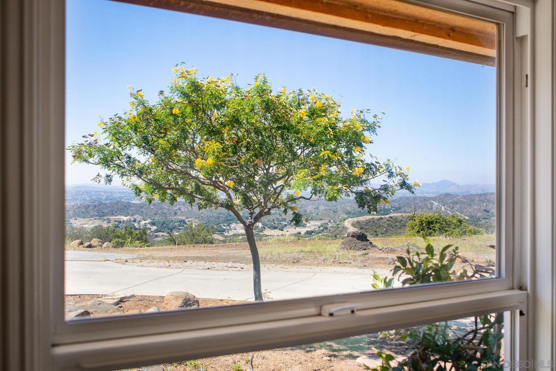 38960 Magee Road Pala, CA 92059 - Photo 6 of 25 a view of a floor to ceiling window and a tree