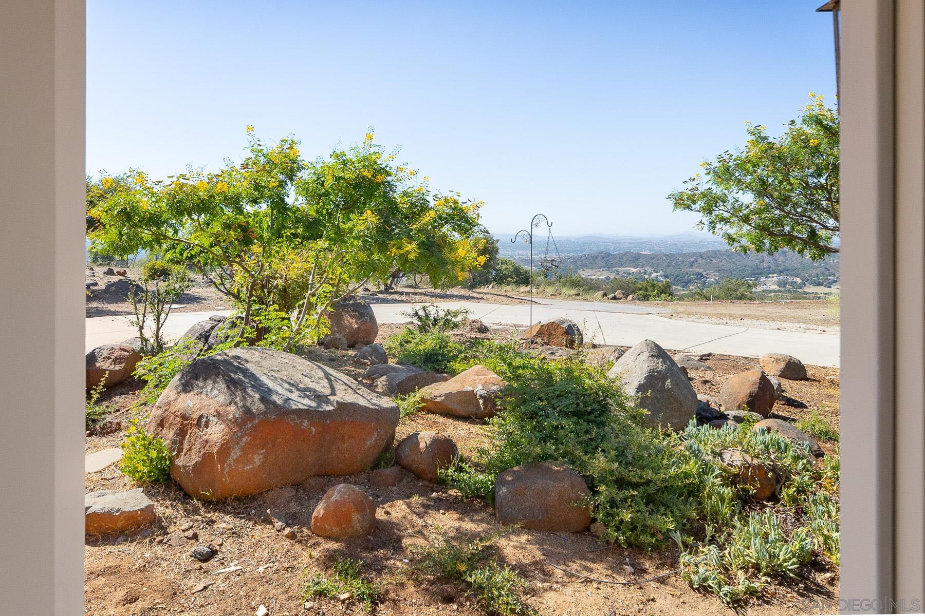 38960 Magee Road Pala, CA 92059 - Photo 10 of 25 a view of a backyard with plants and a garden