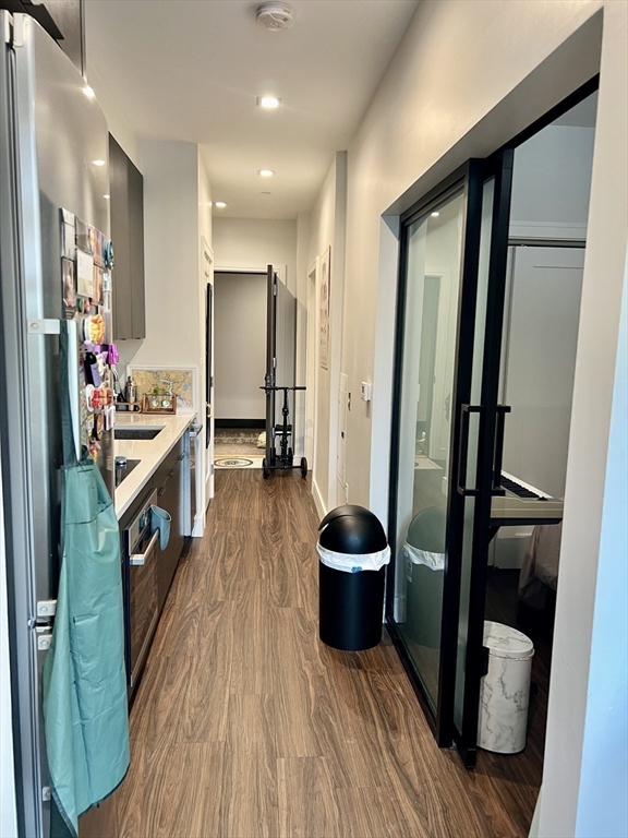 99 Sumner Street, Unit 307 Boston, MA 02128 - Photo 13 of 18 a view of a living room and a wooden floor
