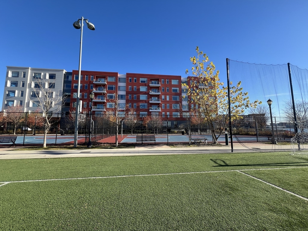 99 Sumner Street, Unit 307 Boston, MA 02128 - Photo 2 of 18 a building view with a playing ground