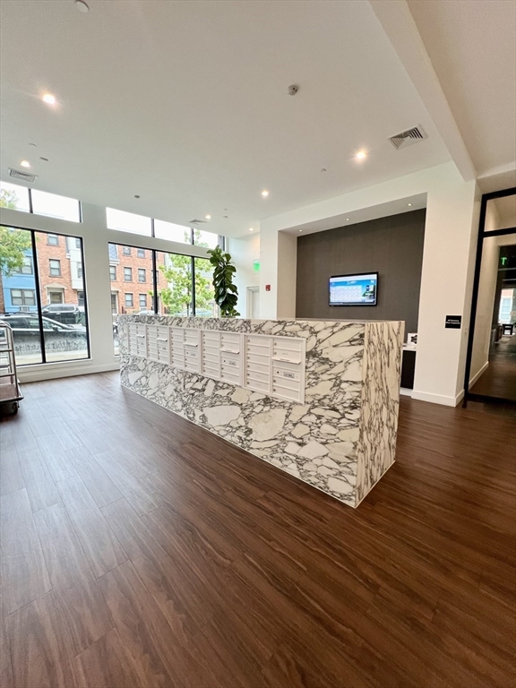 99 Sumner Street, Unit 307 Boston, MA 02128 - Photo 5 of 18 a view of entryway with wooden floor