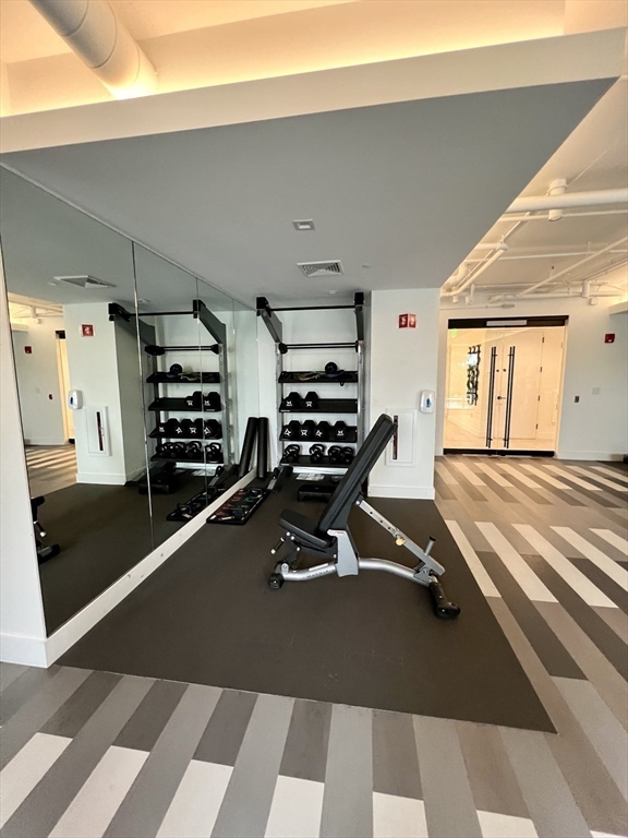 99 Sumner Street, Unit 307 Boston, MA 02128 - Photo 7 of 18 a view of a room with gym equipment