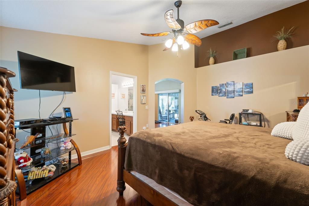 1201 Dustan Place Trinity, FL 34655 - Photo 25 of 78 a bedroom with a bed and a flat screen tv