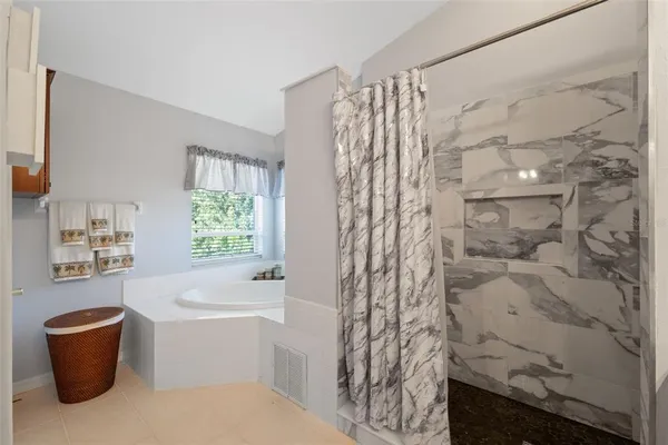 a view of a lake with houses in the back