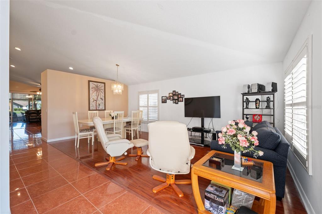 1201 Dustan Place Trinity, FL 34655 - Photo 5 of 78 a living room with furniture and a flat screen tv