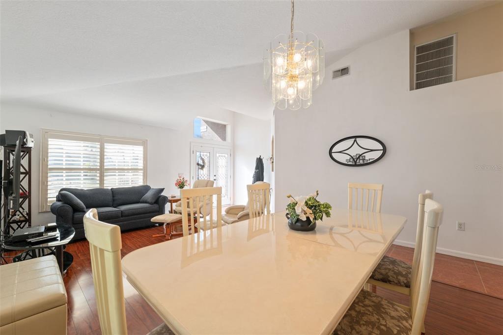 1201 Dustan Place Trinity, FL 34655 - Photo 8 of 78 a view of a dining room with furniture and chandelier