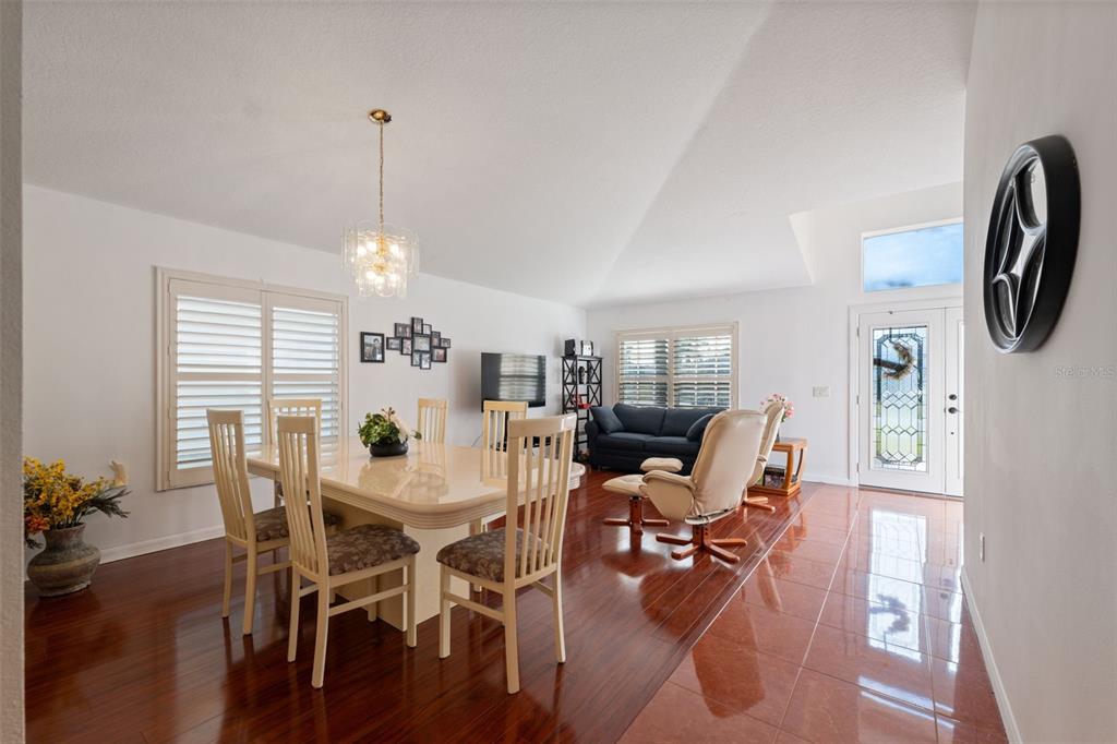 1201 Dustan Place Trinity, FL 34655 - Photo 9 of 78 a view of a dining room with furniture and wooden floor