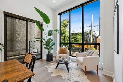 a living room with furniture and a window