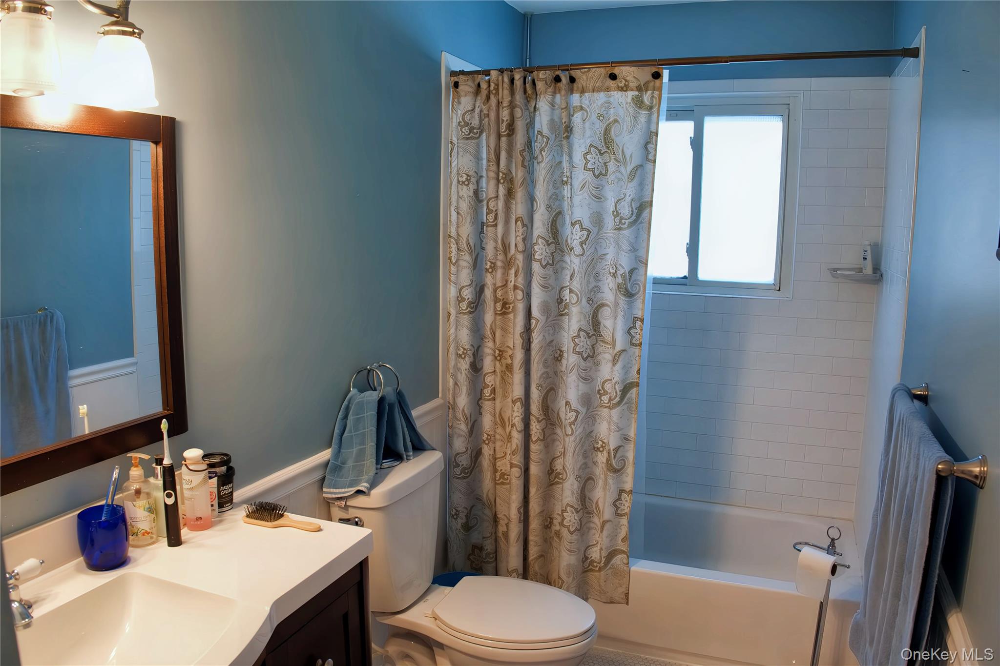 215 Lakeside Trail Ridge, NY 11961 - Photo 10 of 19 a bathroom with a sink a toilet and shower