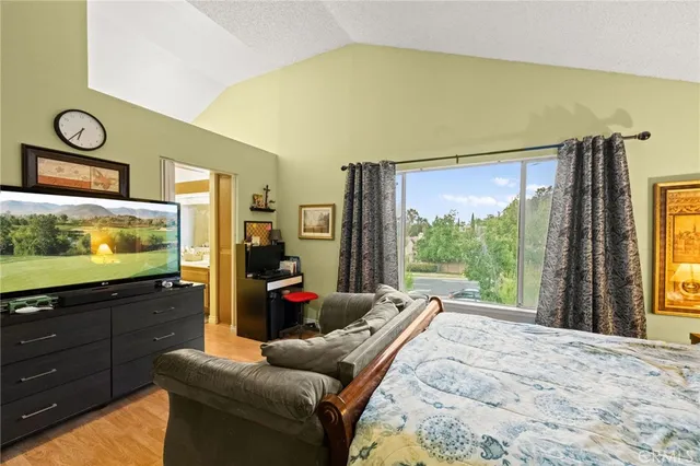 a bed room with a bed and a couch