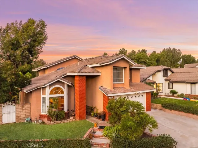 an aerial view of a house with a swimming pool