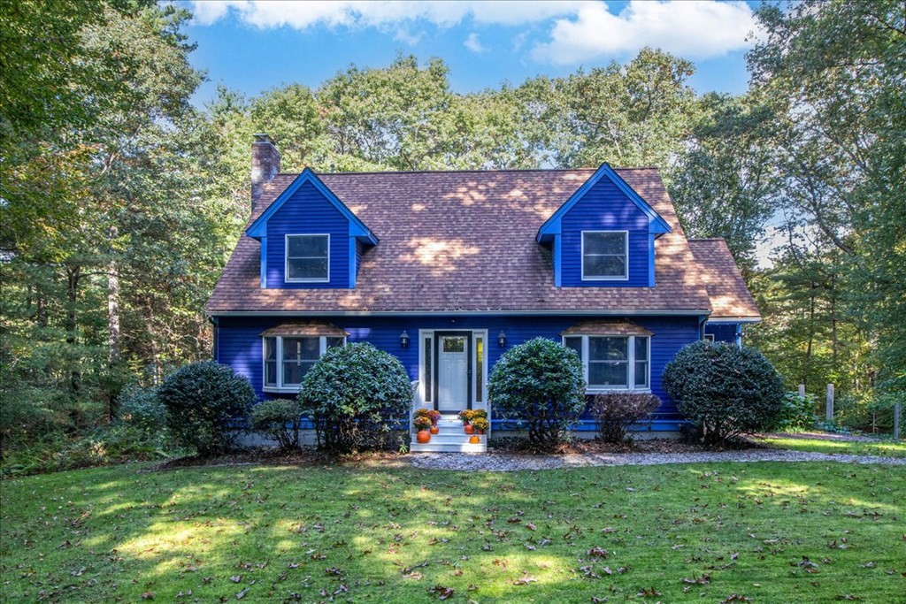 a view of a house with a yard porch and sitting area