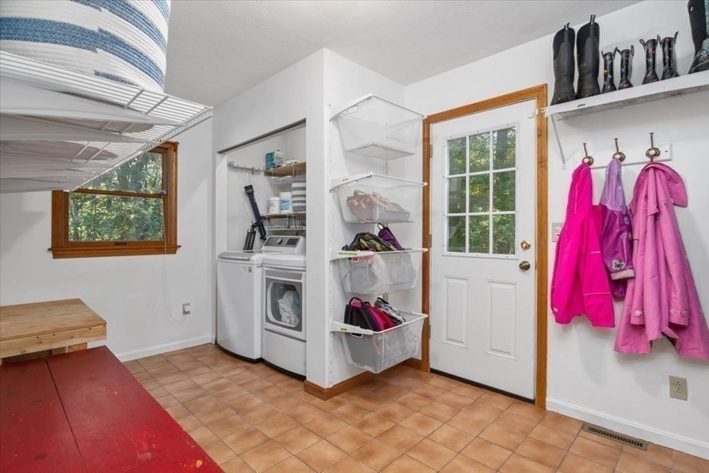 58 High Street Medfield, MA 02052 - Photo 11 of 41 a utility room with dryer and baby