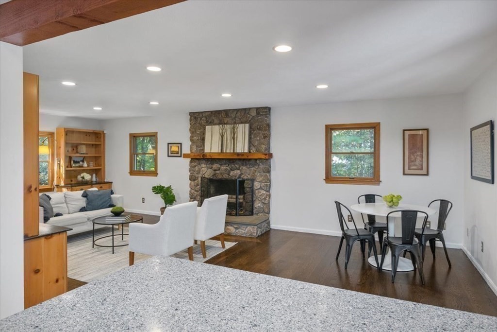58 High Street Medfield, MA 02052 - Photo 16 of 41 a living room with furniture a dining table and a fireplace