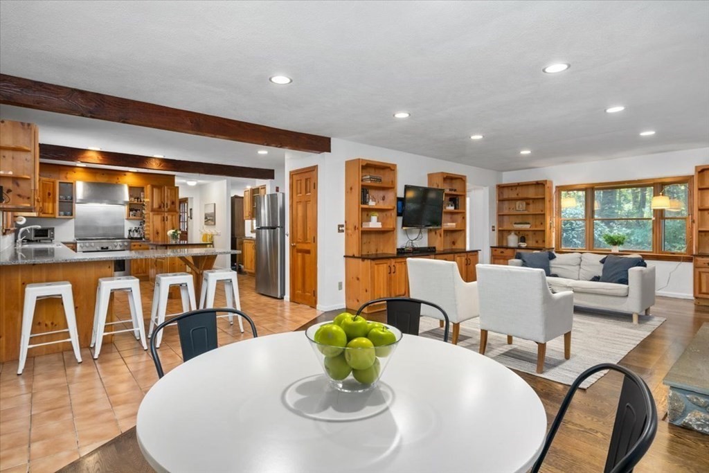 58 High Street Medfield, MA 02052 - Photo 17 of 41 a dining room with furniture a lamp and large windows