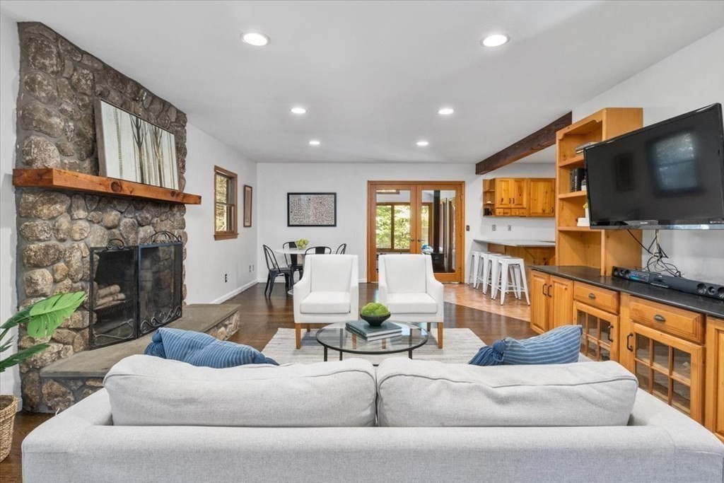 58 High Street Medfield, MA 02052 - Photo 21 of 41 a living room with furniture fireplace and flat screen tv