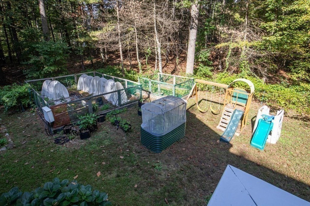 58 High Street Medfield, MA 02052 - Photo 27 of 41 a view of a backyard with plants and outdoor seating