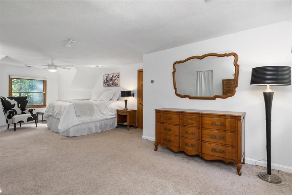 58 High Street Medfield, MA 02052 - Photo 30 of 41 a spacious bedroom with a bed and a couch