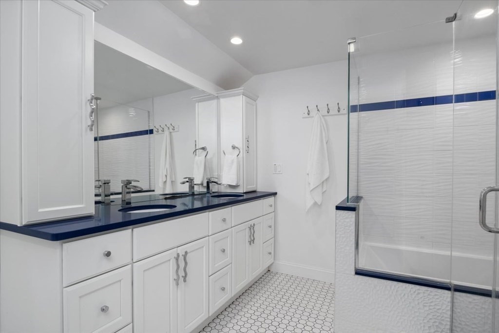 58 High Street Medfield, MA 02052 - Photo 33 of 41 a bathroom with a double vanity sink a mirror and a shower