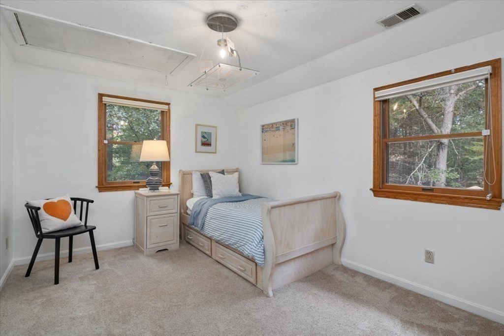 58 High Street Medfield, MA 02052 - Photo 35 of 41 a bedroom with a bed and a painting on the wall