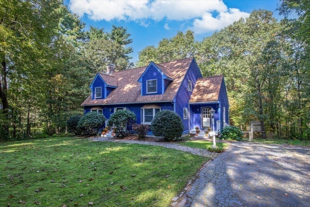 58 High Street Medfield, MA 02052 - Photo 37 of 41 a view of a brick building with many windows and a yard