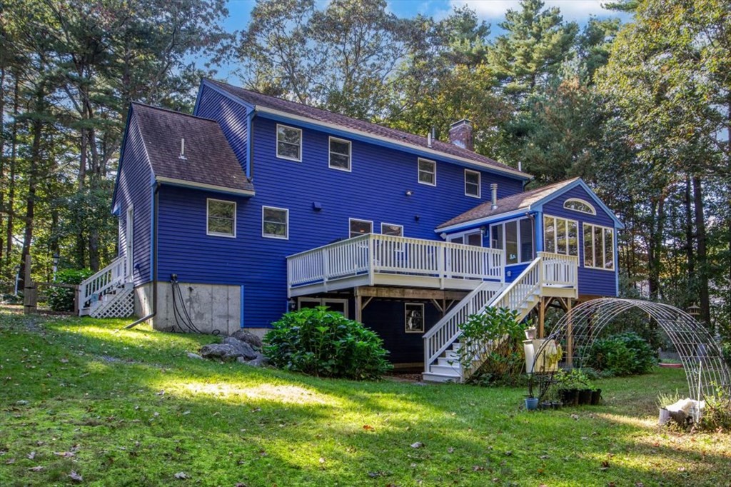 58 High Street Medfield, MA 02052 - Photo 41 of 41 a front view of a house with a yard table and chairs