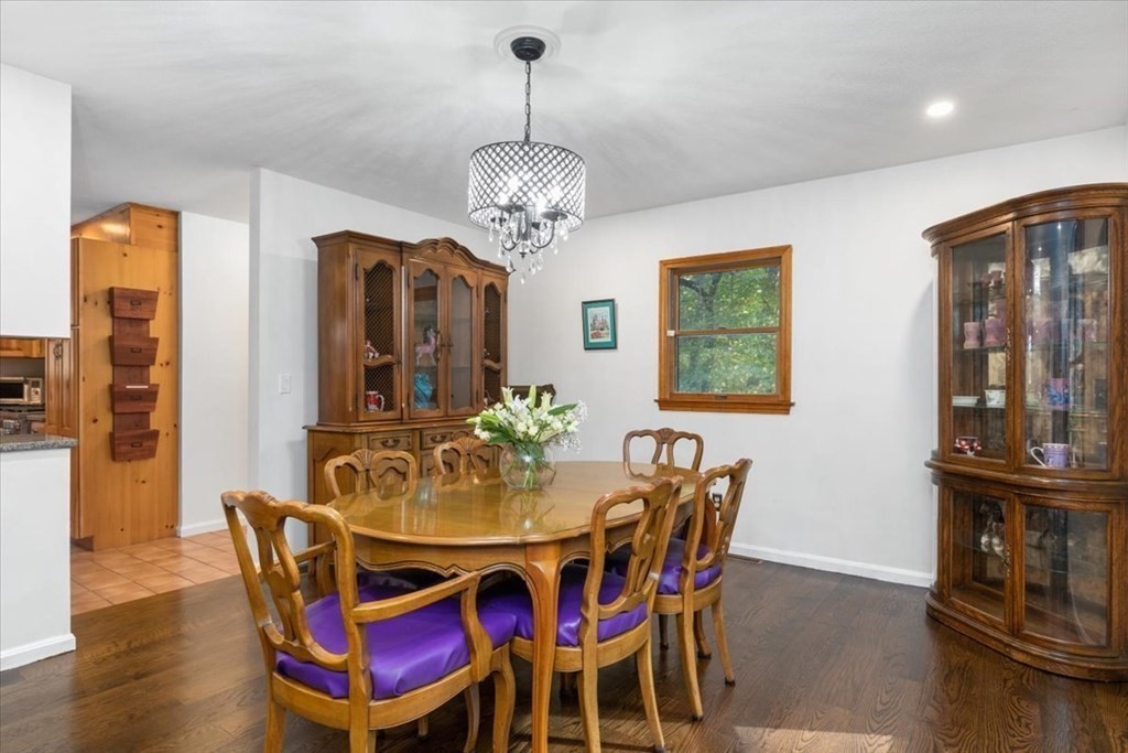 58 High Street Medfield, MA 02052 - Photo 9 of 41 a view of a dining room with furniture wooden floor and chandelier