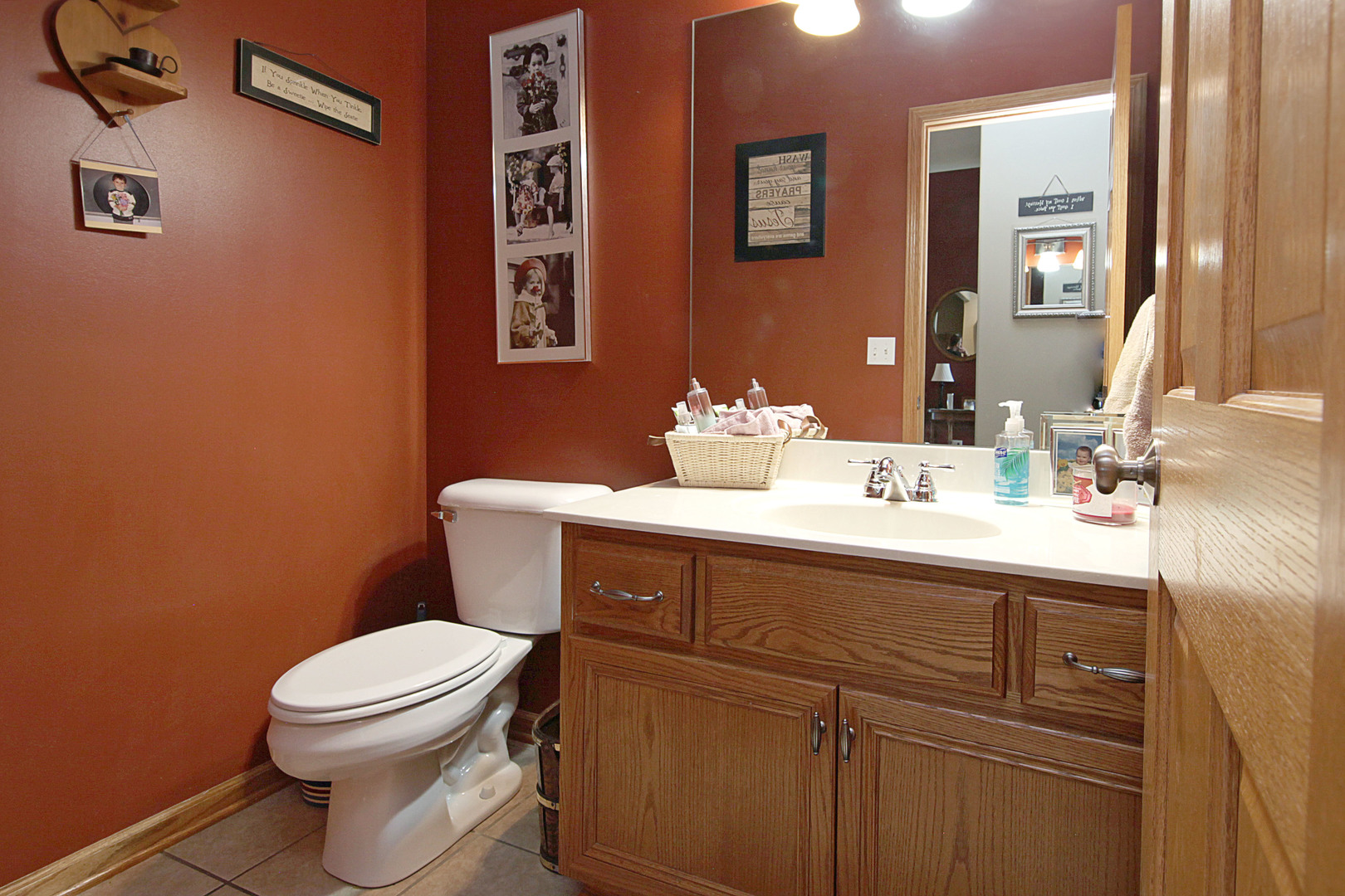 4420 West Shabbona Road Morris, IL 60450 - Photo 14 of 31 a bathroom with a sink mirror vanity and toilet