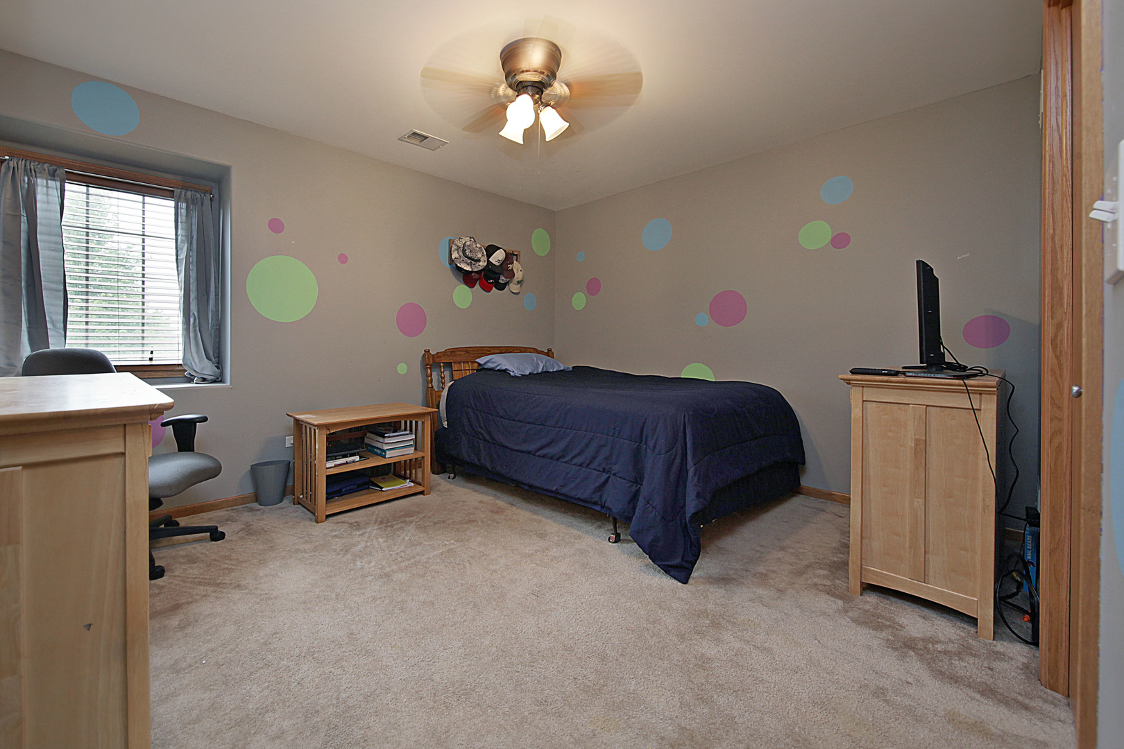 4420 West Shabbona Road Morris, IL 60450 - Photo 18 of 31 a bedroom with a bed and a chandelier