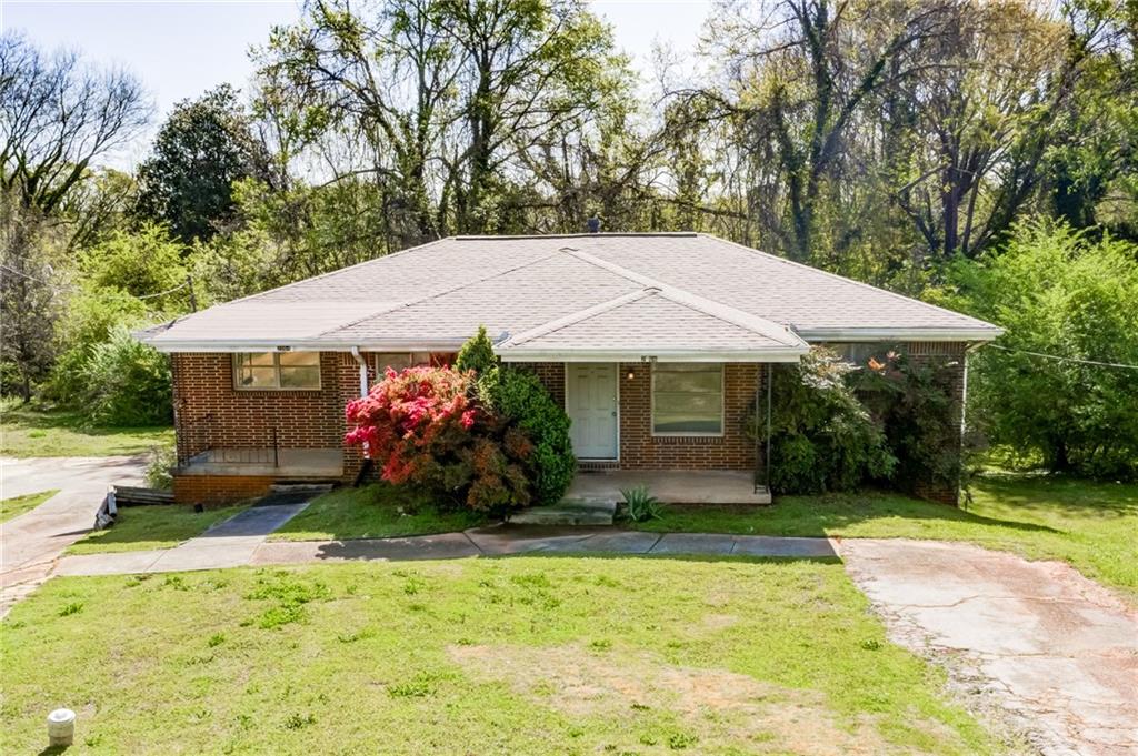 2066 Nettie Court Decatur, GA 30032 - Photo 1 of 1 a front view of a house with garden
