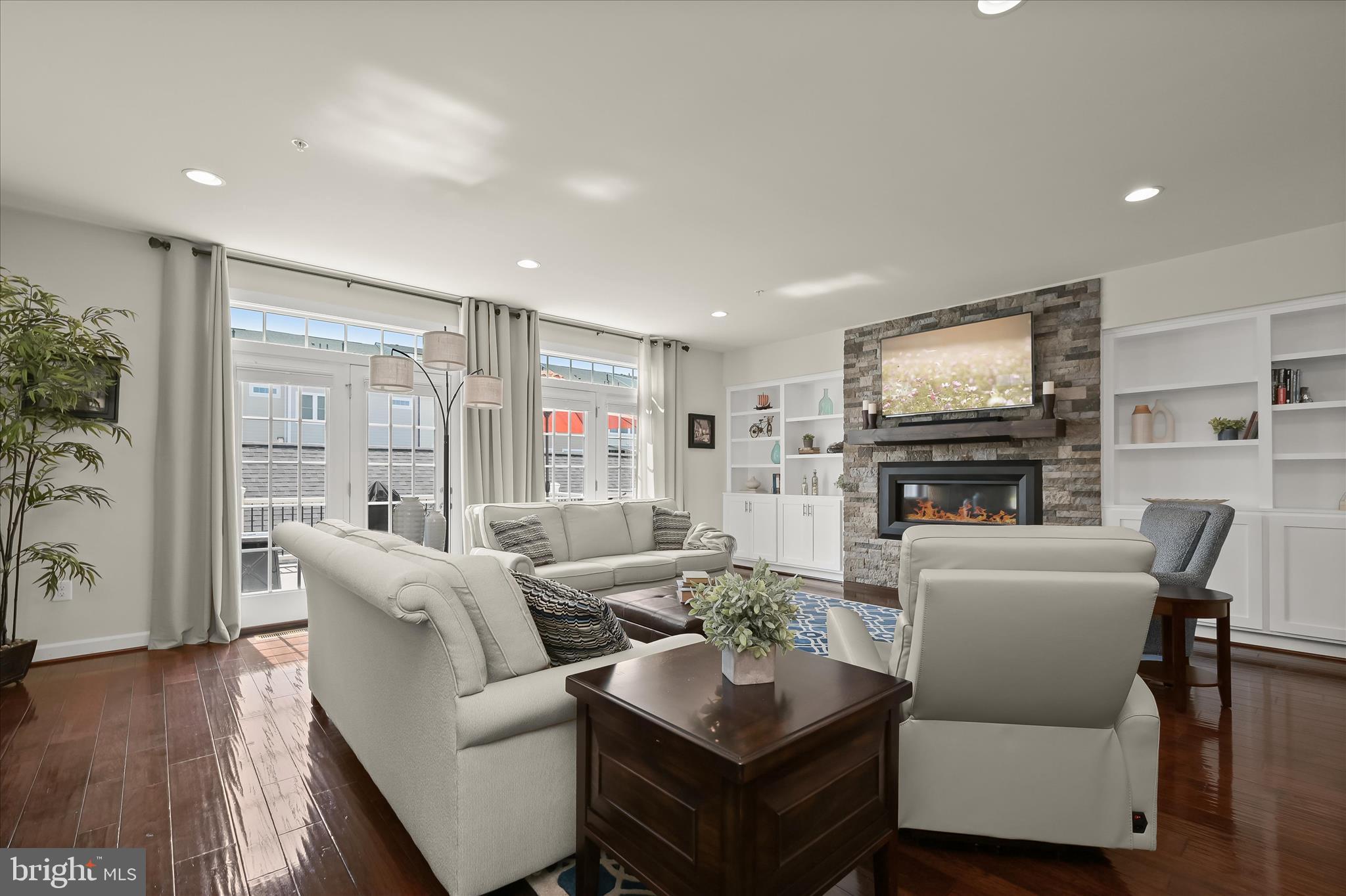 11285 Terrace Lane Fulton, MD 20759 - Photo 22 of 52 a living room with furniture a fireplace and a flat screen tv