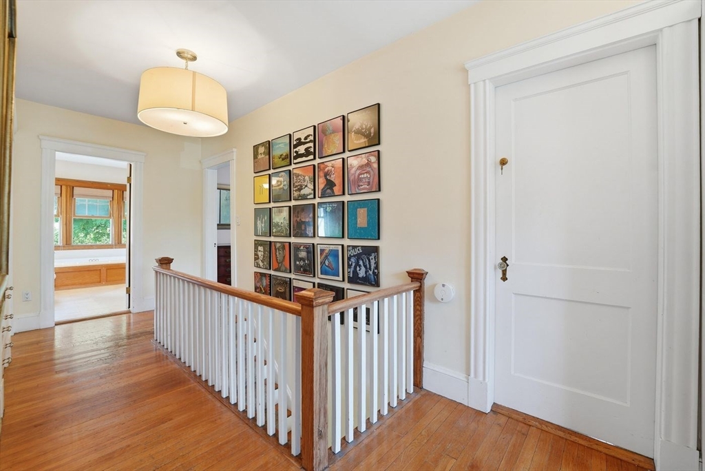 19 Humphrey Street Marblehead, MA 01945 - Photo 15 of 29 a view of a hallway with wooden floor and staircase
