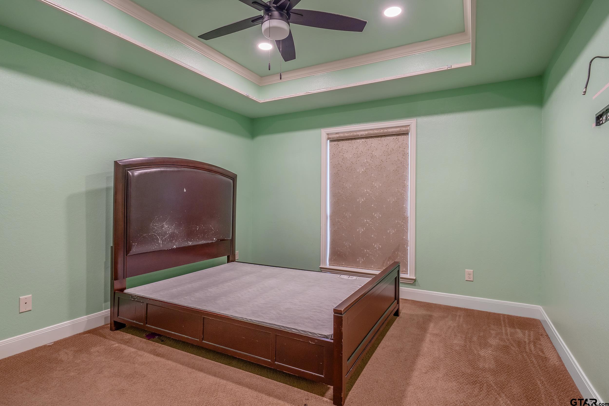 3072 Yasmeen Circle Flint, TX 75762 - Photo 17 of 26 a room with a bed and a ceiling fan