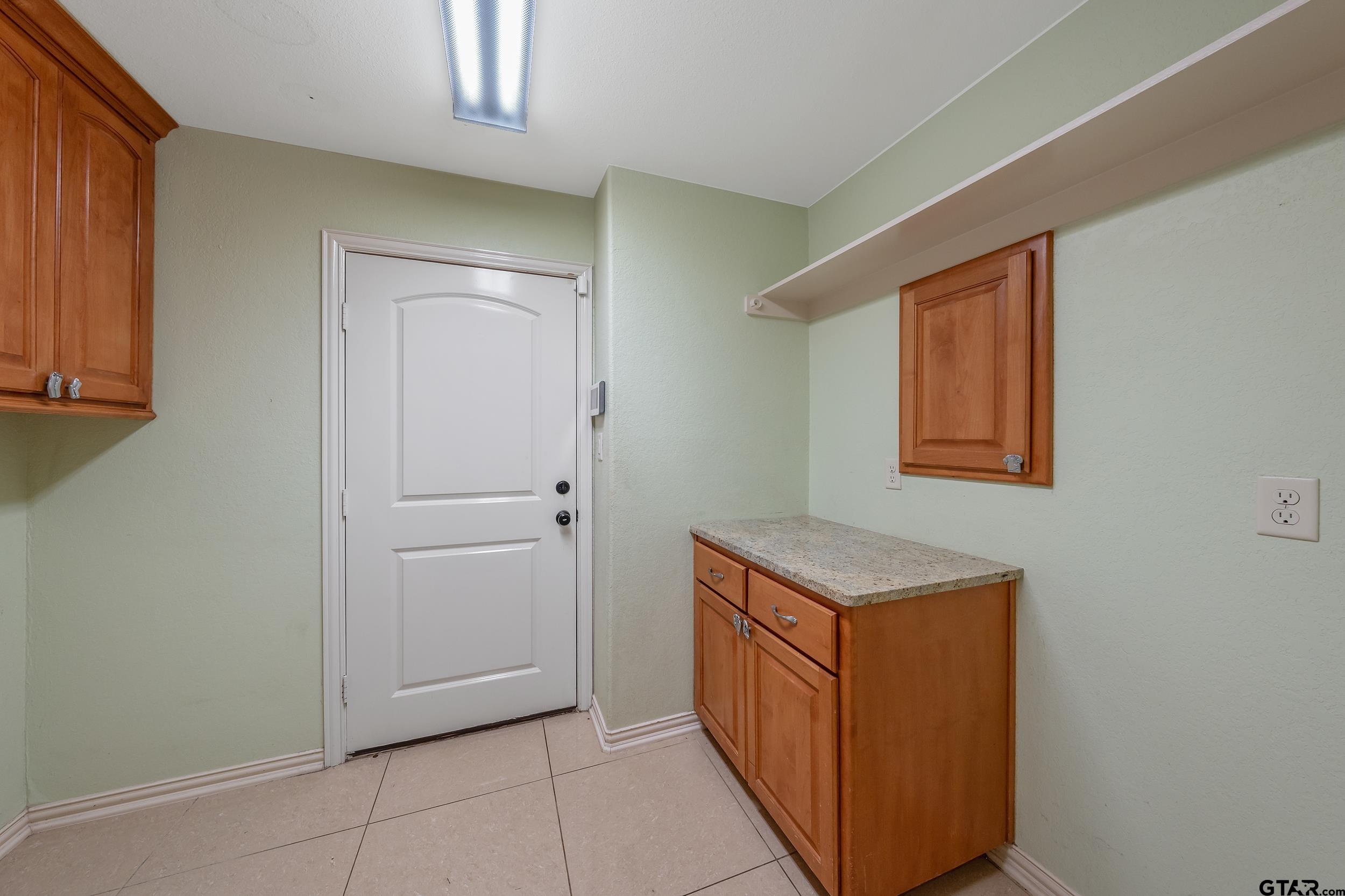 3072 Yasmeen Circle Flint, TX 75762 - Photo 22 of 26 a hallway with cabinets