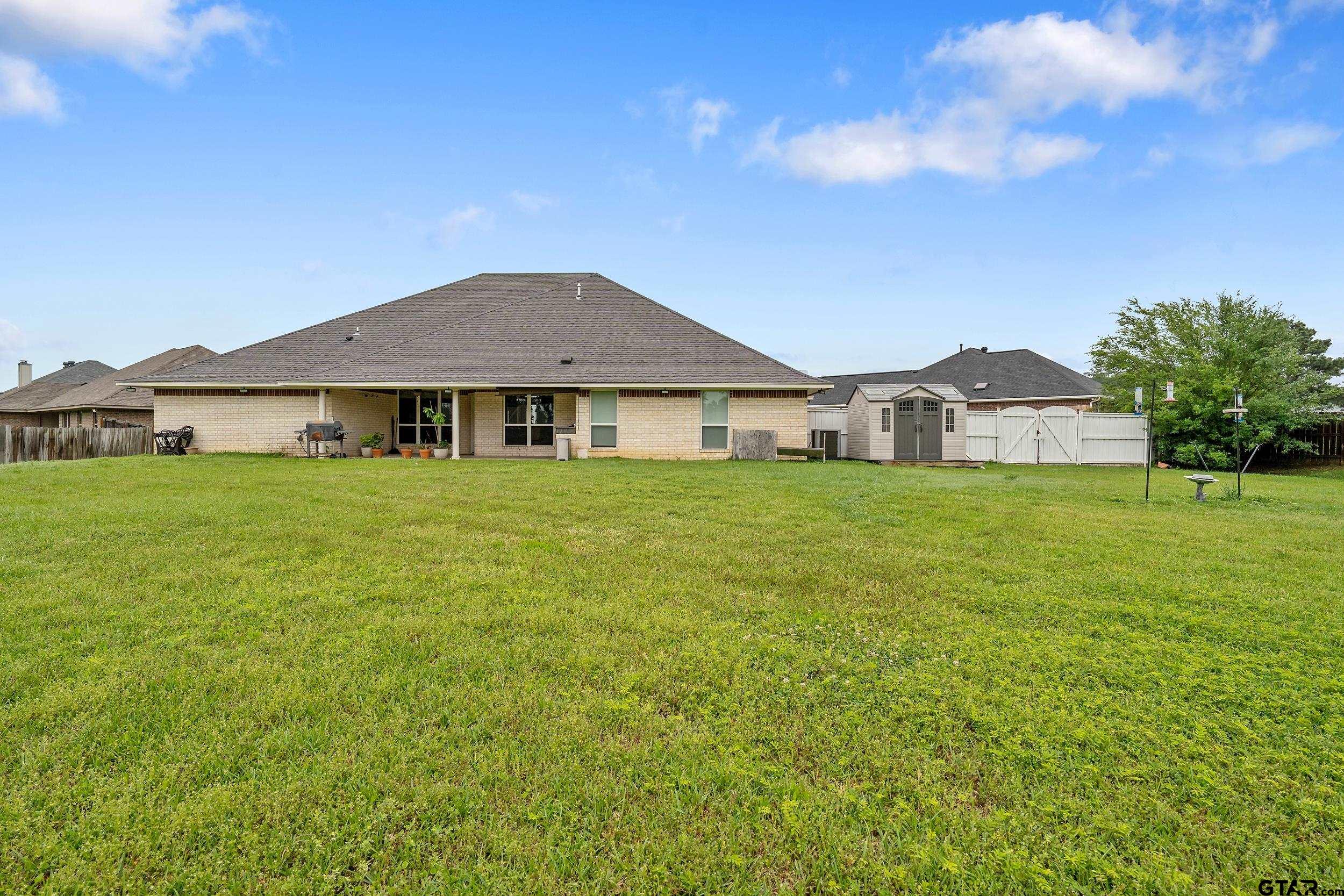 3072 Yasmeen Circle Flint, TX 75762 - Photo 25 of 26 a house with a garden in front of it