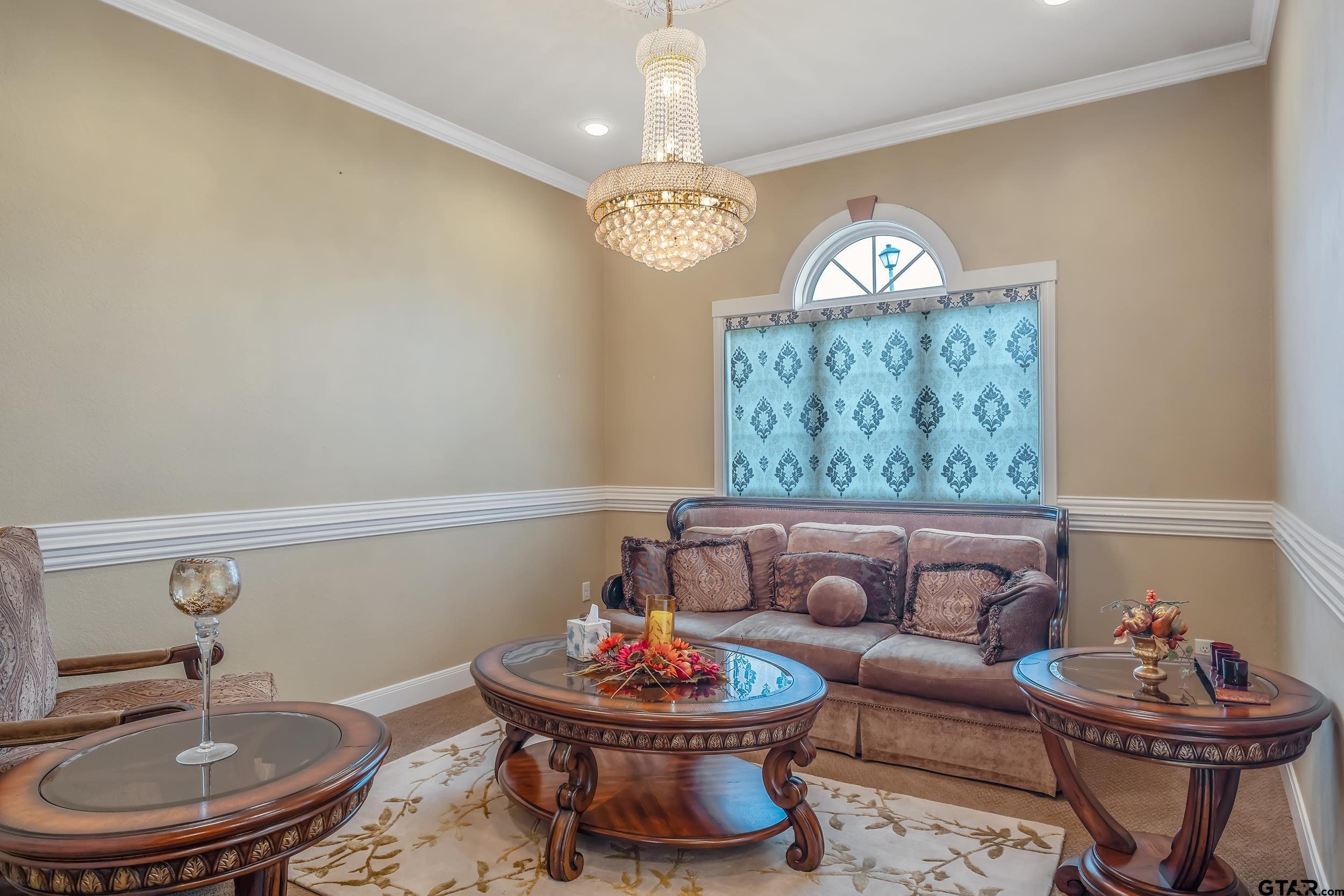 3072 Yasmeen Circle Flint, TX 75762 - Photo 5 of 26 a living room with furniture a rug and a chandelier