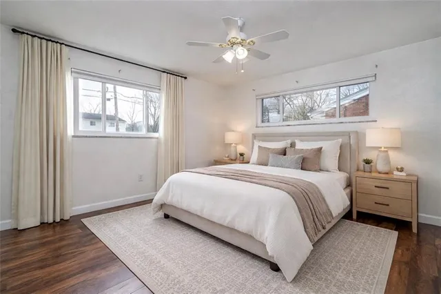 a bedroom with a large bed and a window