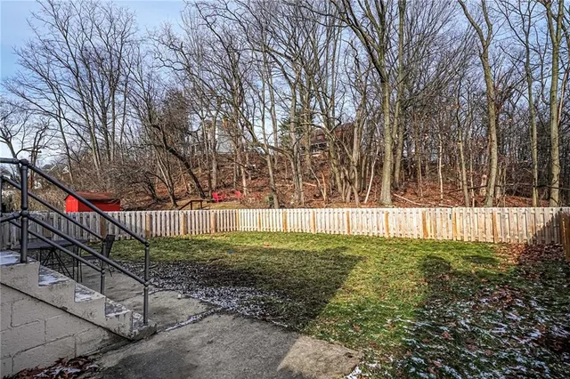 a view of yard and basketball court