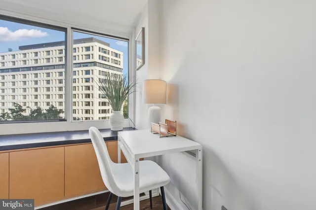 a view of a dining room with furniture and window