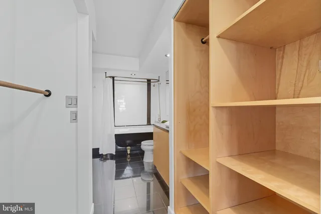 a bathroom with a tub and a shower