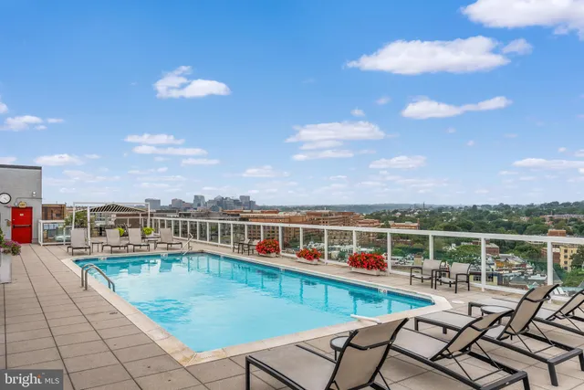 a view of a balcony with two chairs and a table