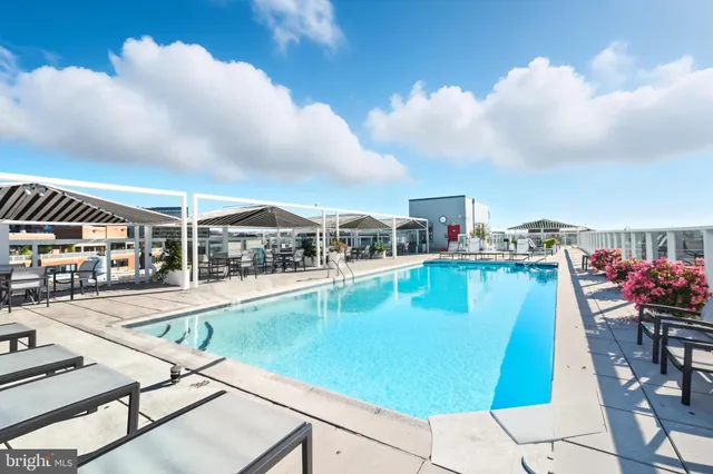 a view of a swimming pool with a lounge chairs